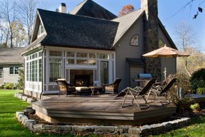 double indoor outdoor fireplace by Teakwood Builders, kitchen and bath remodeler, custom home builder and general contractor Saratoga Springs and Capital Region