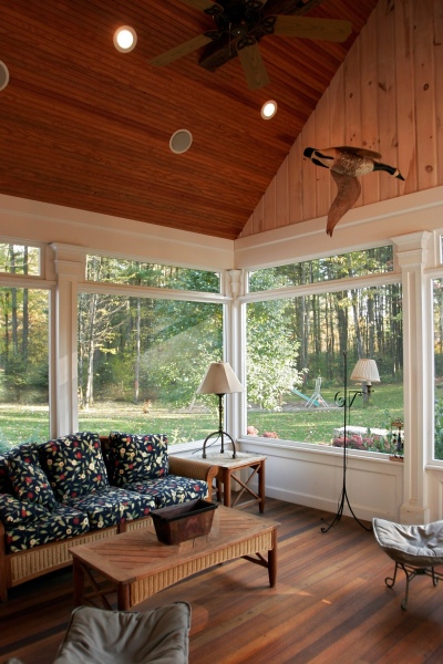 The elegant mahogany floors installed by Teakwood Builders in the screened porch are both beautiful and durable, standing up well to the elements.