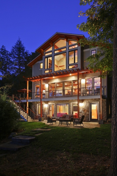 Within restrictive zoning requirements, Teakwood worked to make sure the client didn’t lose out on any of the features that make this home breathtaking. The three-level living space features acres of glass, but avoids a sterile, modern feel through liberal use of rich timber and native stone.