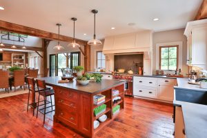 With a mantel-style hood, which rests on the counter, it's important to have enough space to the left and right of the range to slide a pan off the burner onto the counter. By Teakwood Builders, kitchen and bath remodeler, custom home builder and general contractor Saratoga Springs and Capital Region.