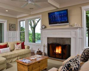 Lake Lonely fireplace with custom millwork white mantel by Teakwood Builders, kitchen and bath remodeler, custom home builder and general contractor Saratoga Springs and Capital Region