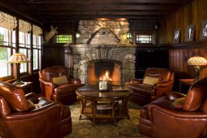 Adirondack camp fireplace by Teakwood Builders, kitchen and bath remodeler, custom home builder and general contractor Saratoga Springs and Capital Region