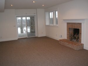 Brick fireplace before renovation by Teakwood Builders, kitchen and bath remodeler, custom home builder and general contractor Saratoga Springs and Capital Region