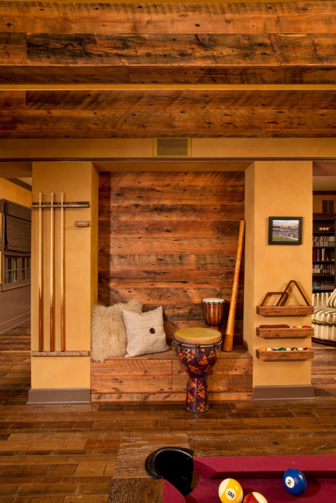 An Albany family had Teakwood Builders build game room cubby seats so their kids would have comfortable spots to cuddle when sharing the space with adults. The nooks also serve to dampen sound and provide storage.